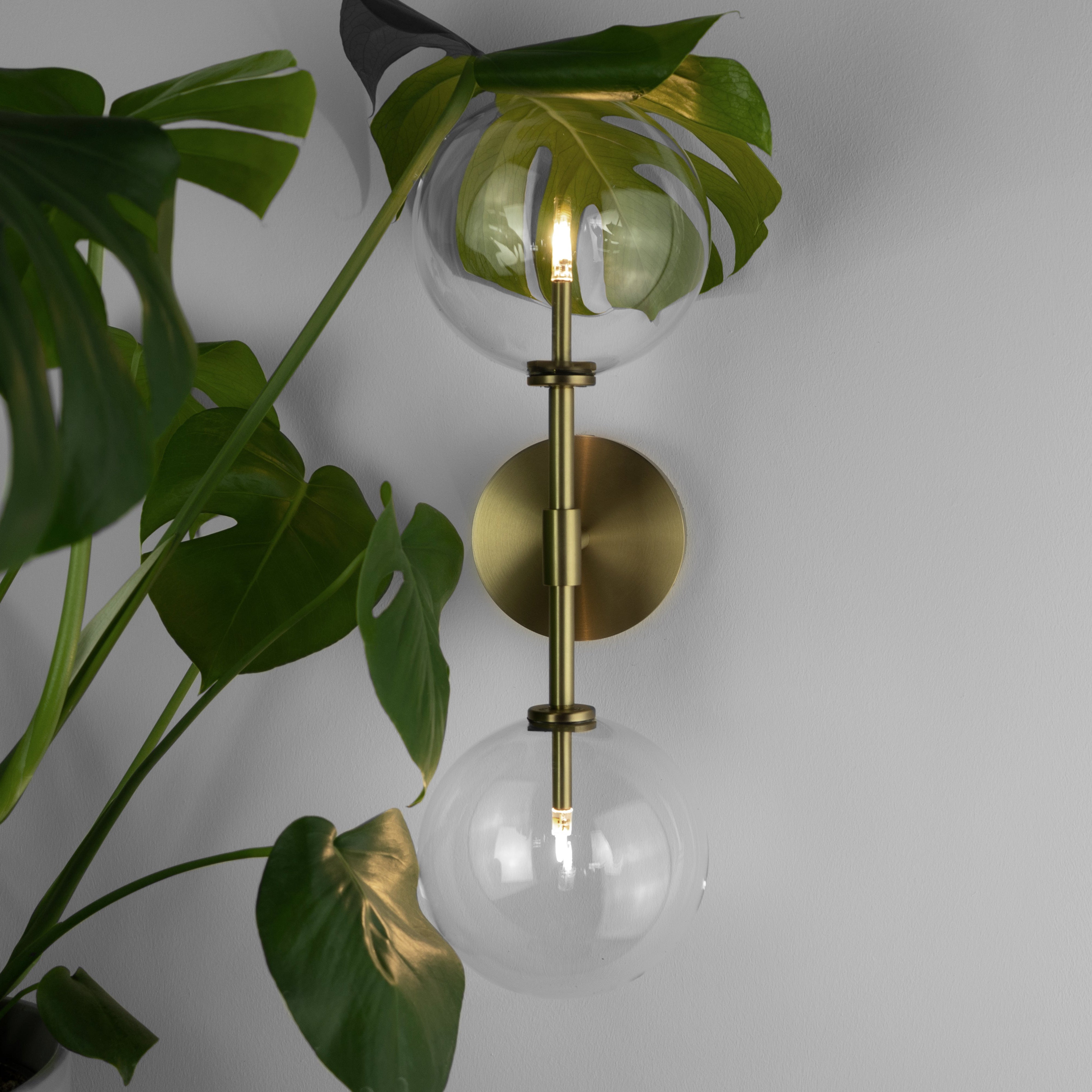 Schwung Dawn Dual Burnished Brass Transparent Globe Wall Light